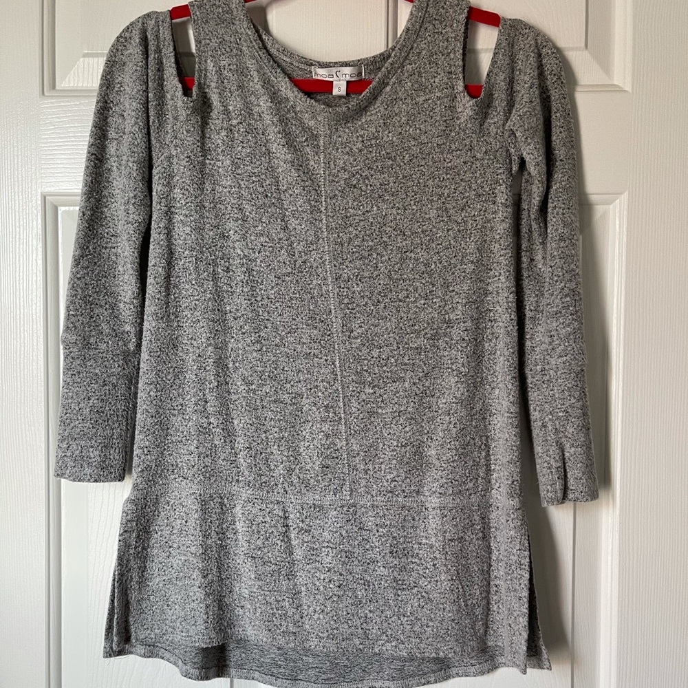 Gray sweater with shoulder cut outs.